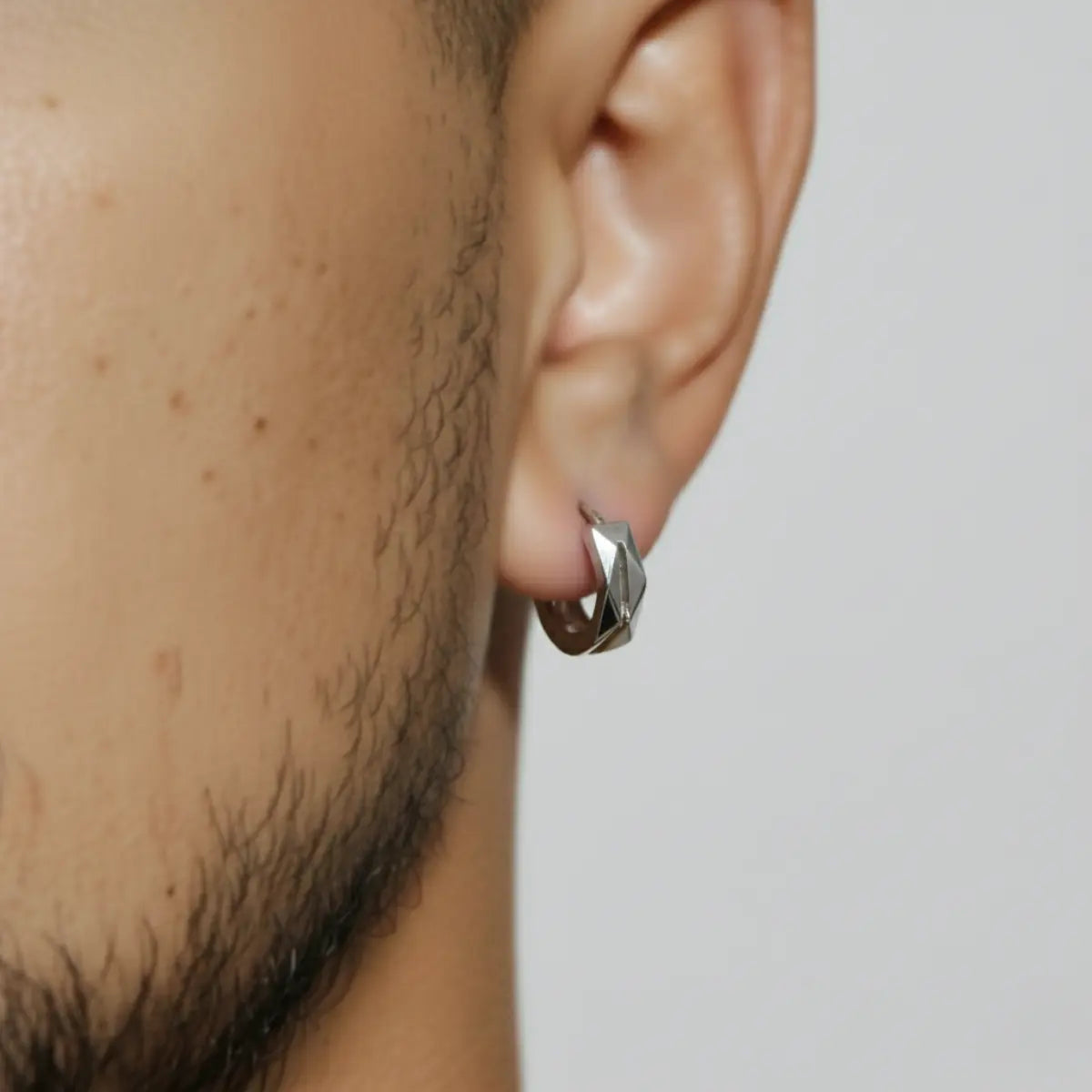 Geometric Hoop Earrings Silver Worn by Male Model Close Up