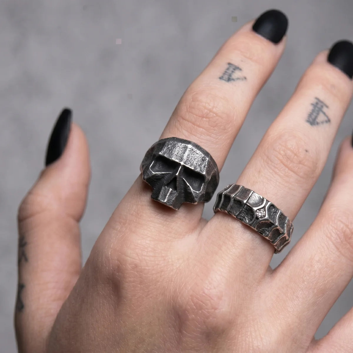 Geometric Skull Ring and Dragon Scale Ring Worn by Female Model