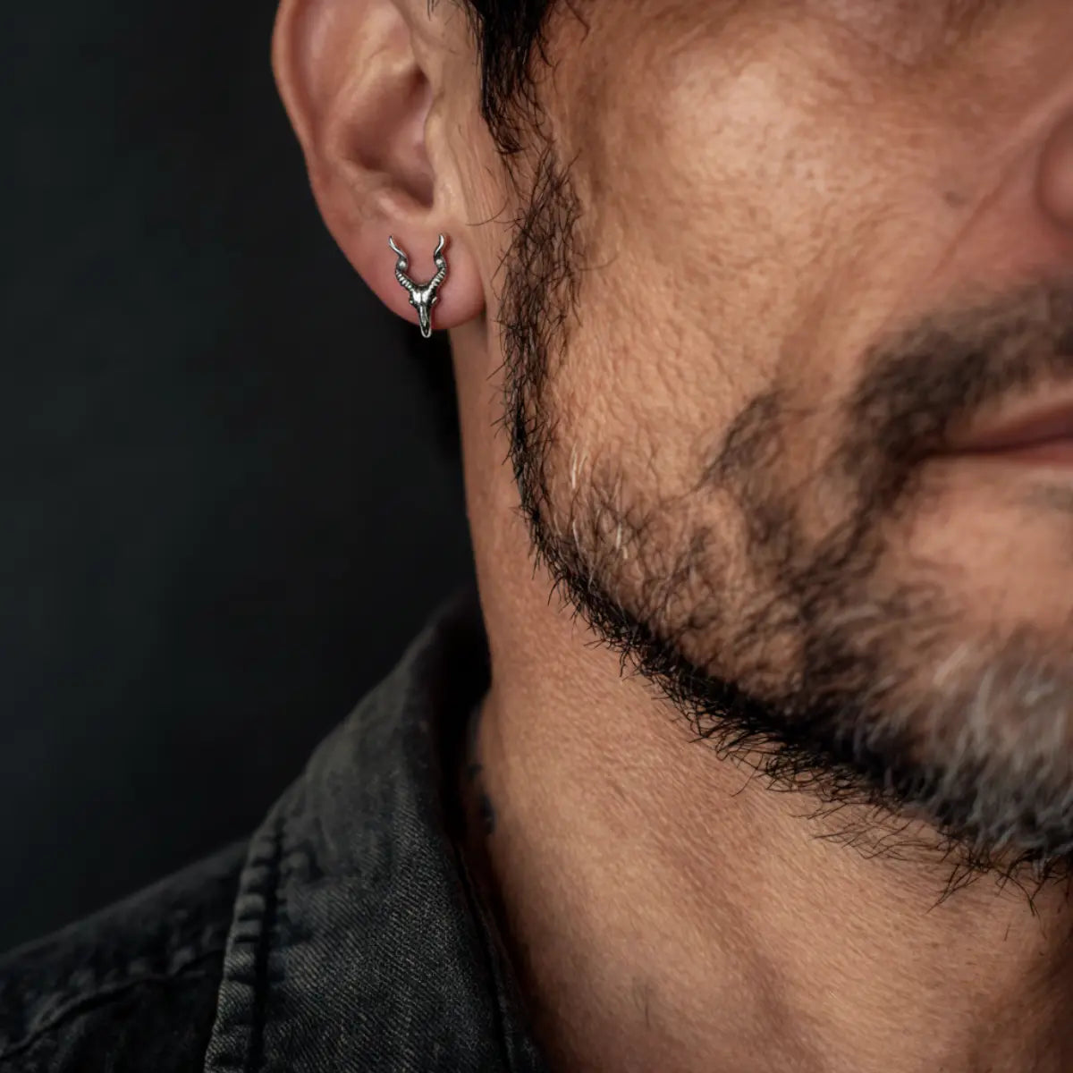 Goat Skull Stud Earrings Sterling Silver Worn by Male Model Close Up