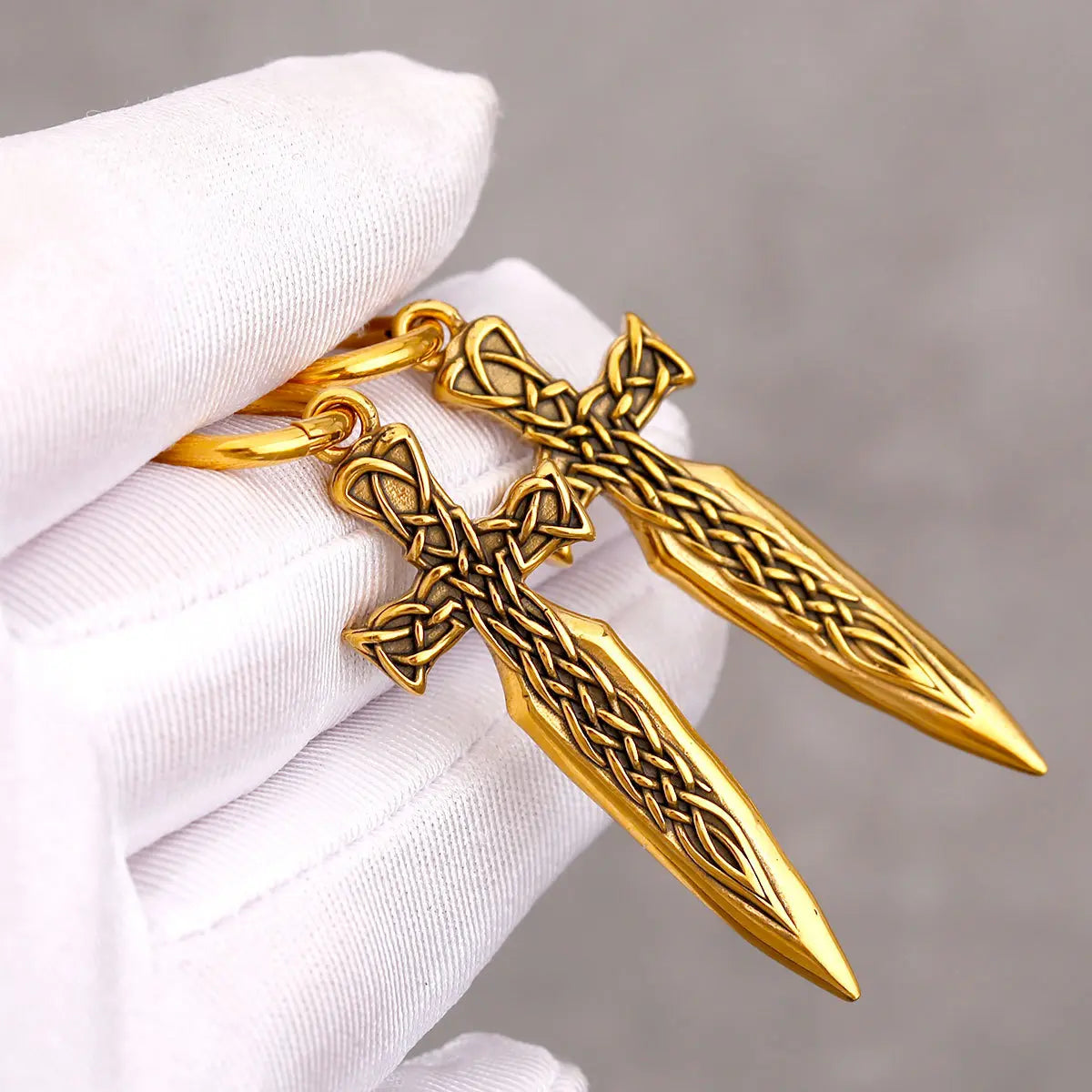 Gold Celtic Knot Sword Earrings Close Up