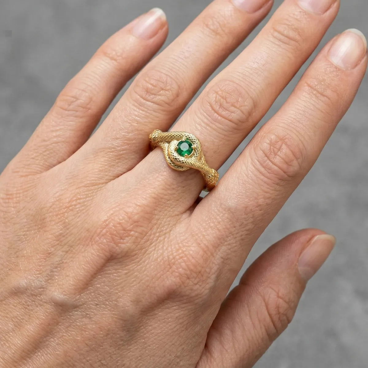 Gold Green Stone Snake Ring Worn by Female Model