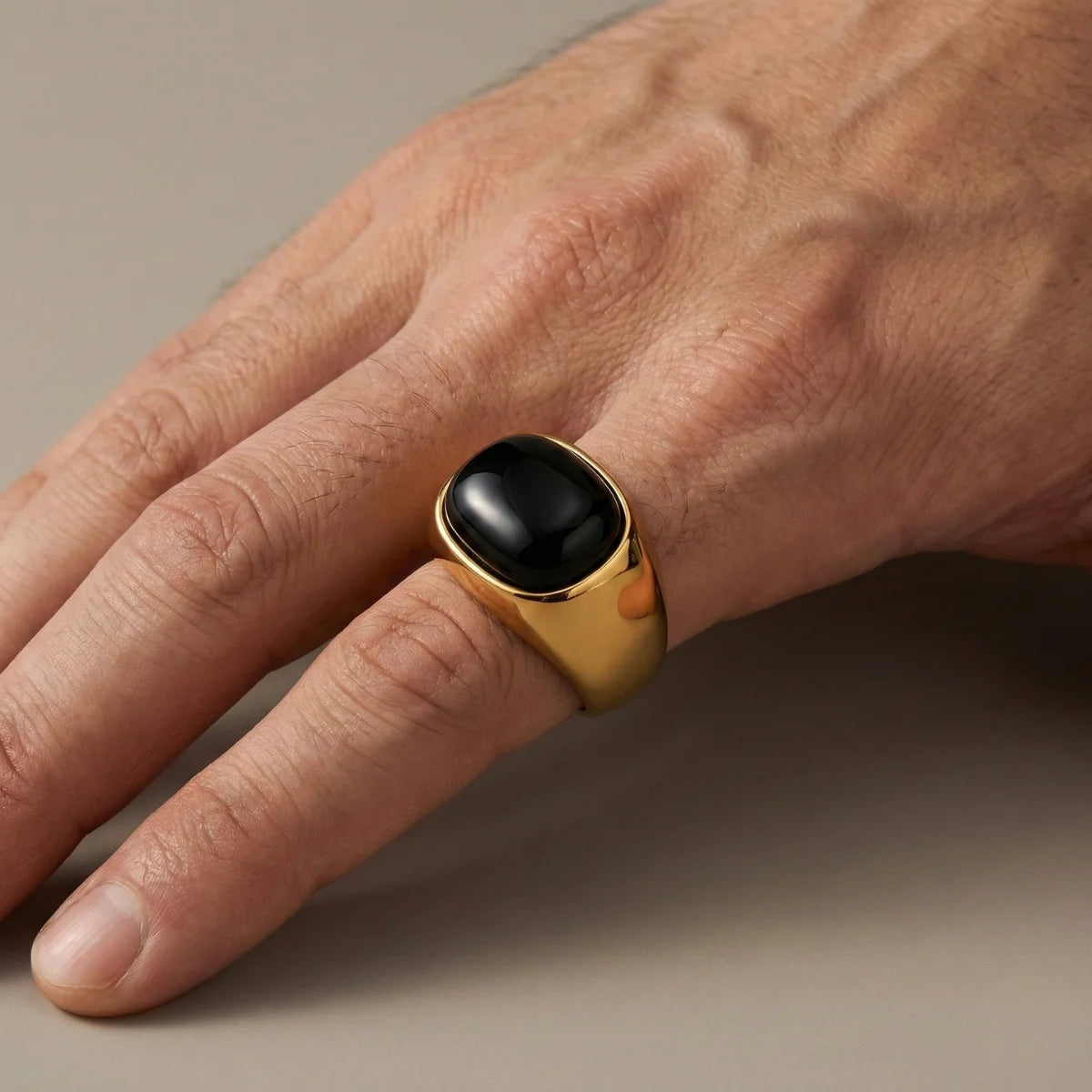 Gold Ring with Black Stone Worn by Male Model Close Up