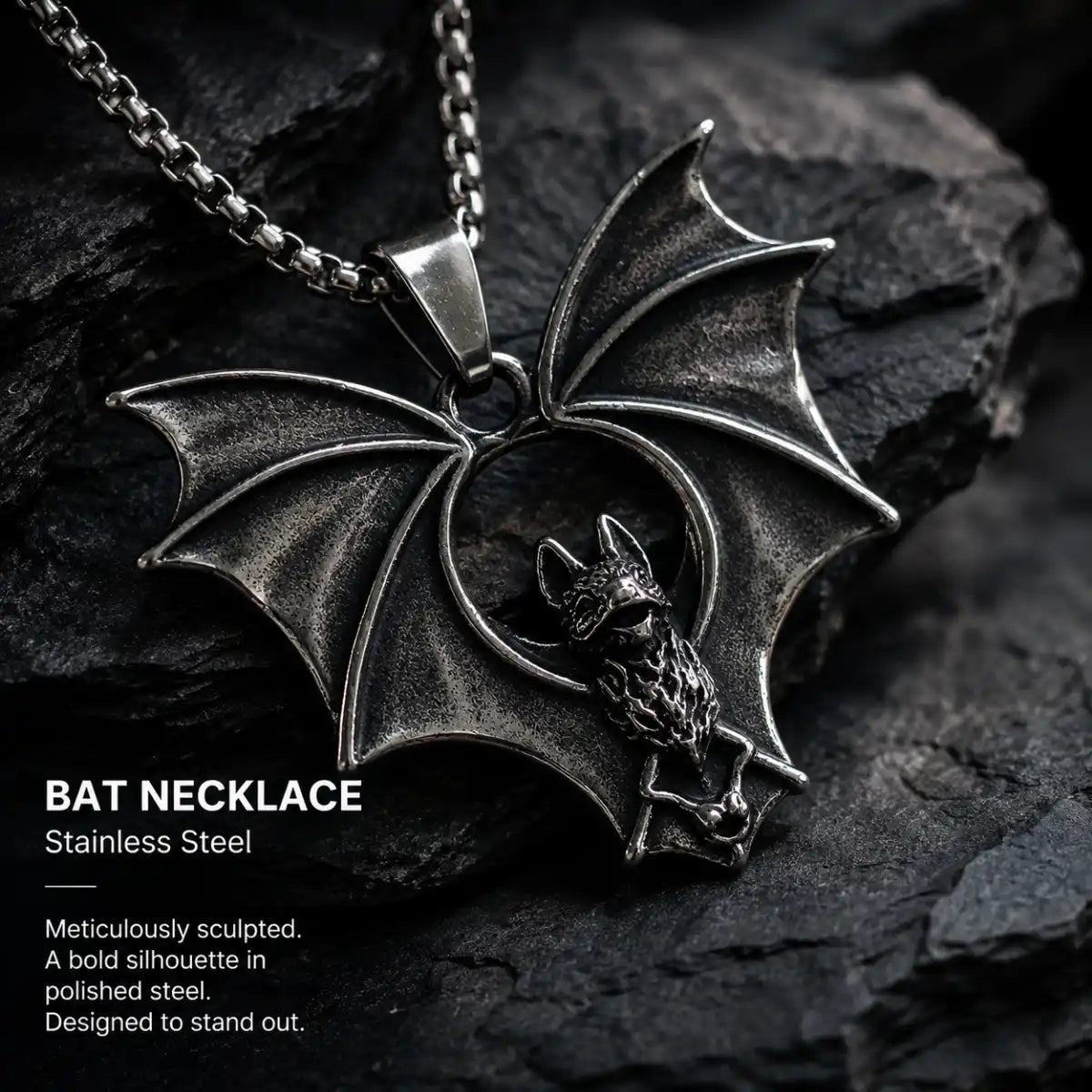 Gothic Bat Necklace Silver Displayed on Stone Surface