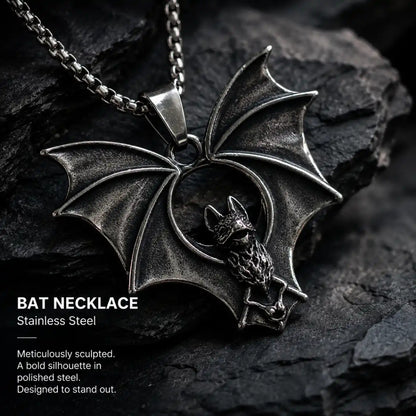 Gothic Bat Necklace Silver Displayed on Stone Surface