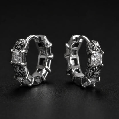 Gothic Cross CZ Huggie Hoop Earrings Silver Pair Close Up Black Background