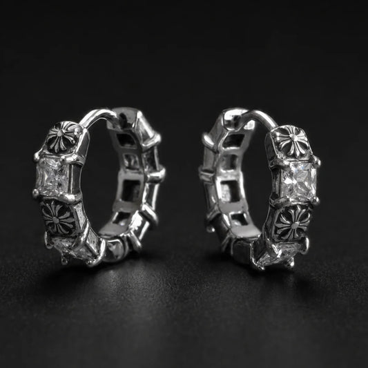 Gothic Cross CZ Huggie Hoop Earrings Silver Pair Close Up Black Background