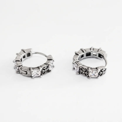Gothic Cross CZ Huggie Hoop Earrings Silver Pair Flat Lay White Background
