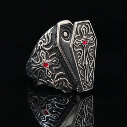 Gothic Cross Coffin Ring with Red Gemstone Close Up Black Background
