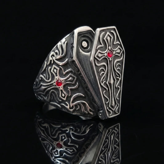 Gothic Cross Coffin Ring with Red Gemstone Close Up Black Background