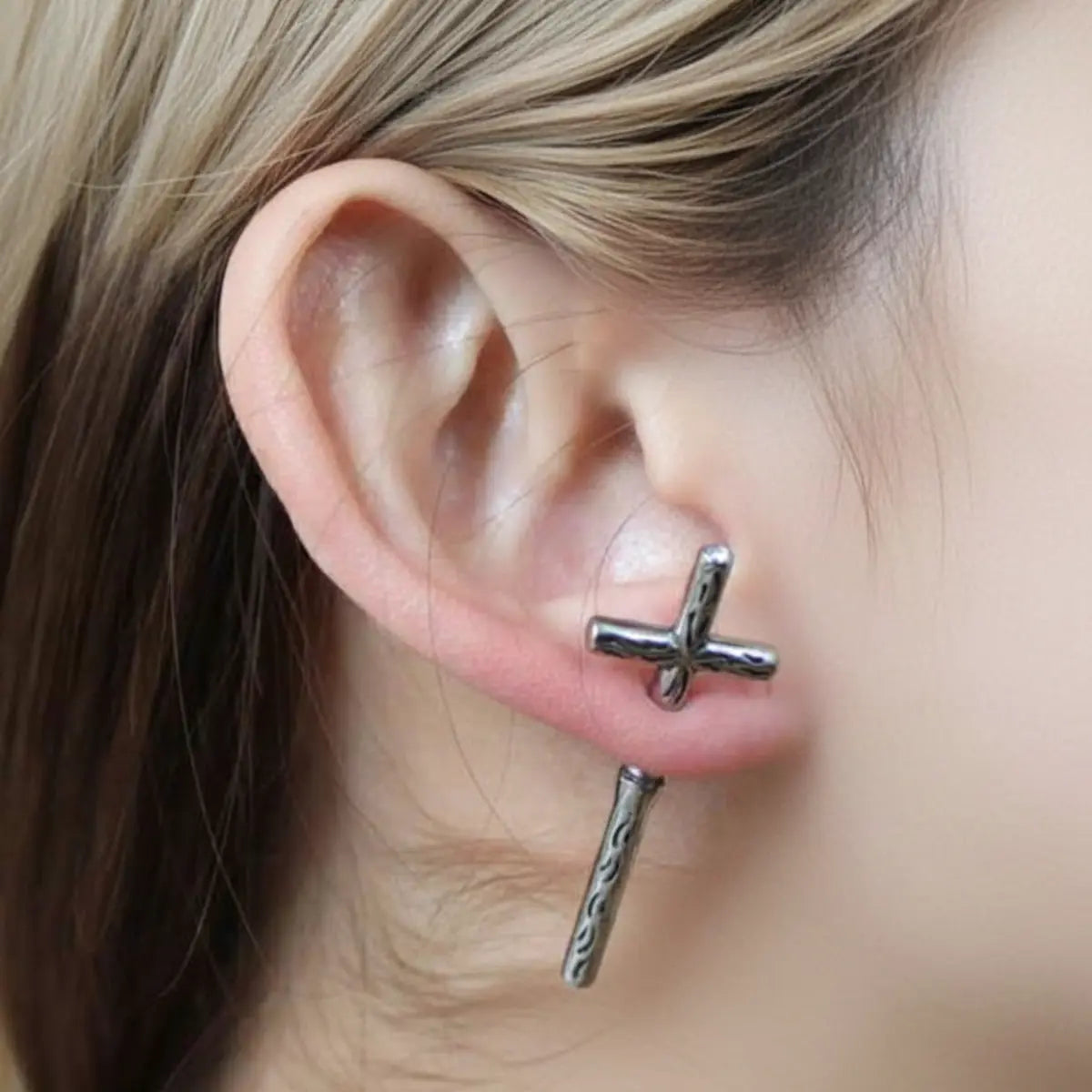 Gothic Cross Earrings Through Ear Worn by Female Model