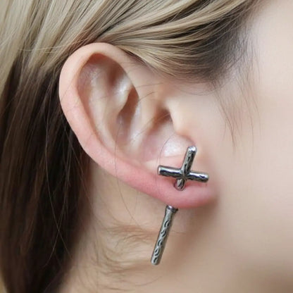 Gothic Cross Earrings Through Ear Worn by Female Model