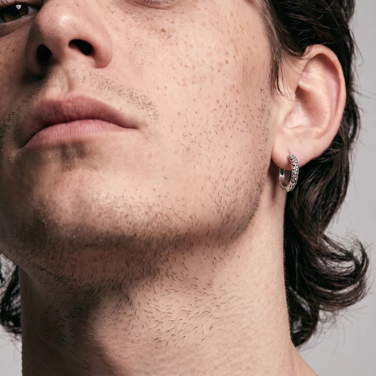 Gothic Floral Huggie Earrings Silver Worn by Male Model