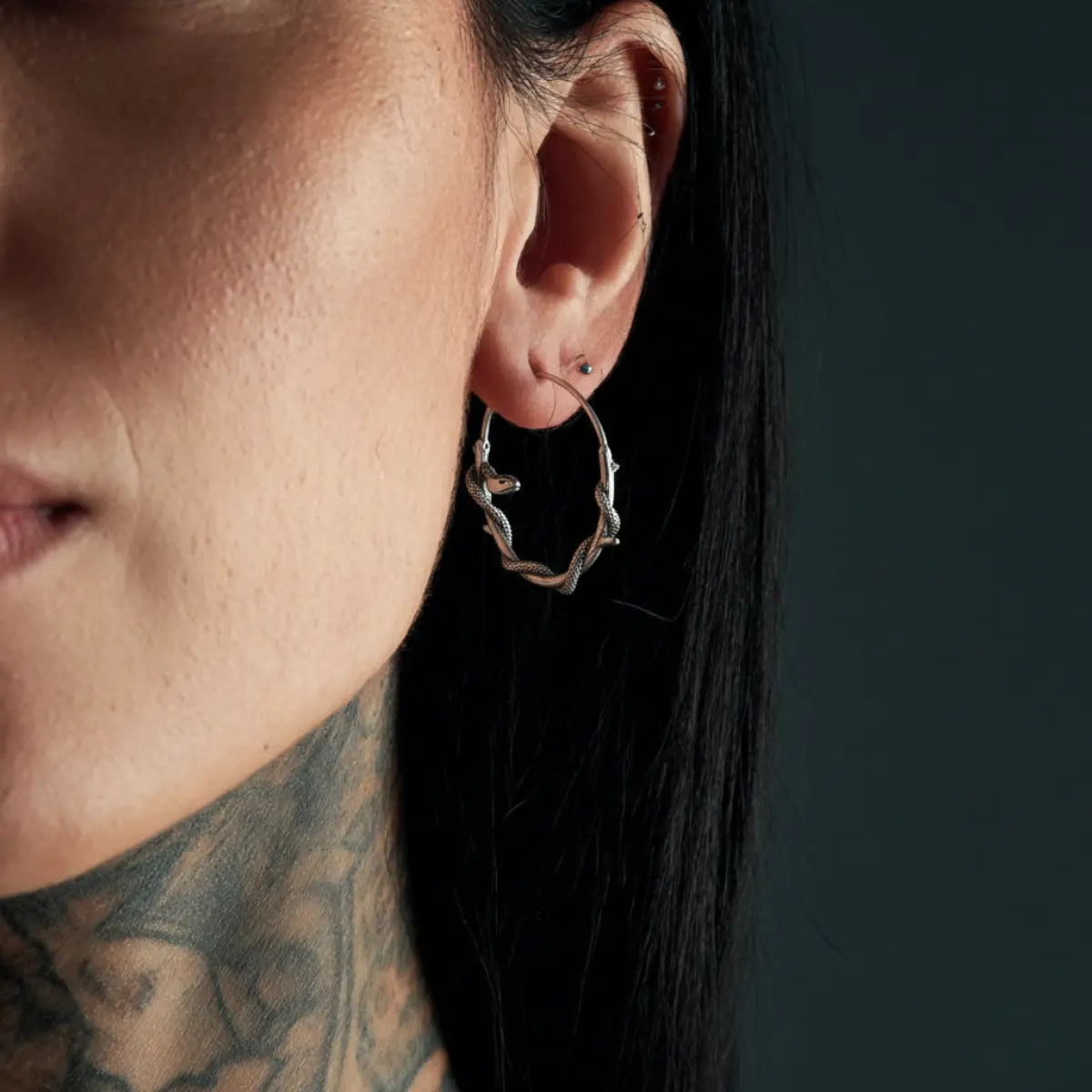 Gothic Snake Hoop Earrings Worn by Female Model Close Up