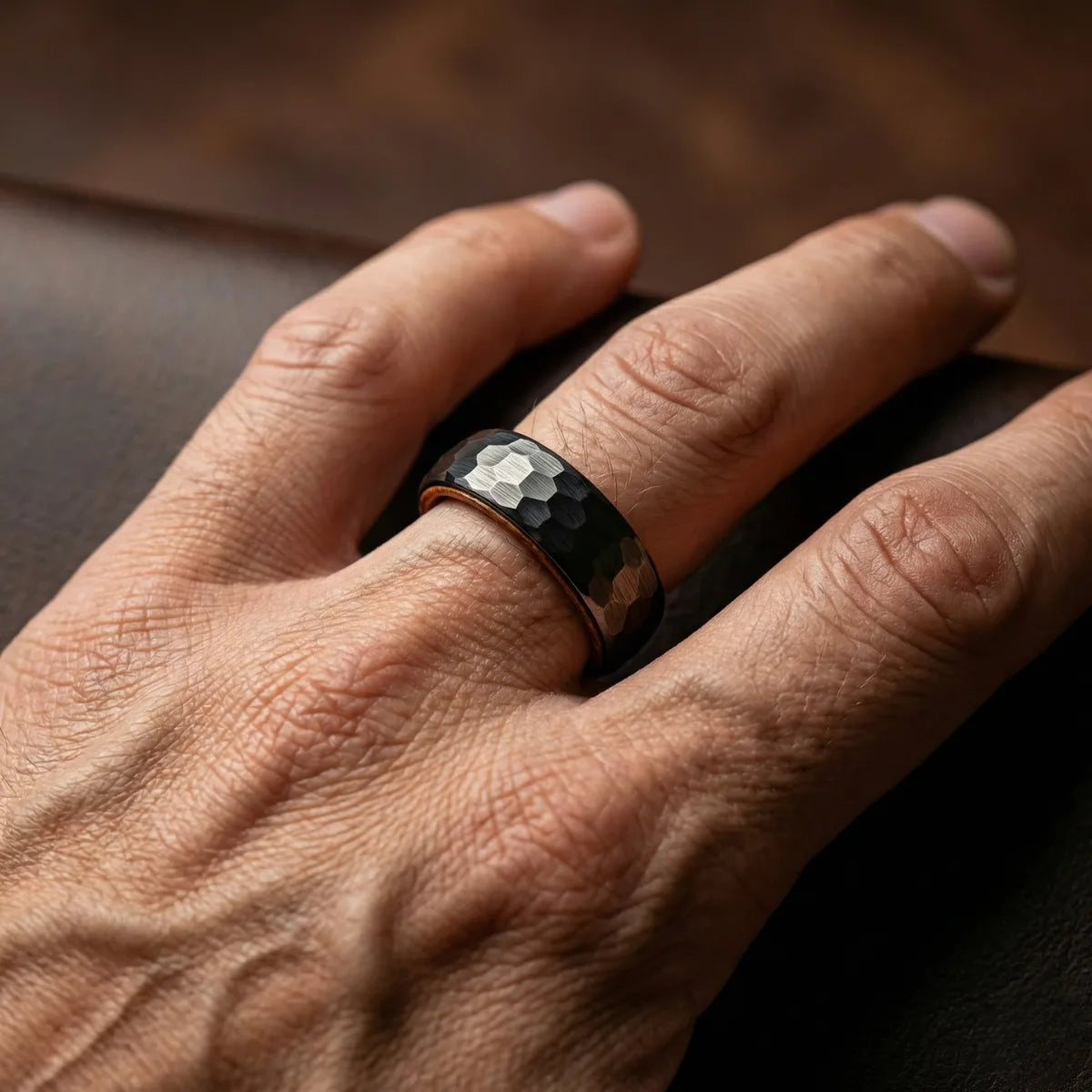 Hammered Whiskey Barrel Tungsten Ring Worn by Male Model Close Up