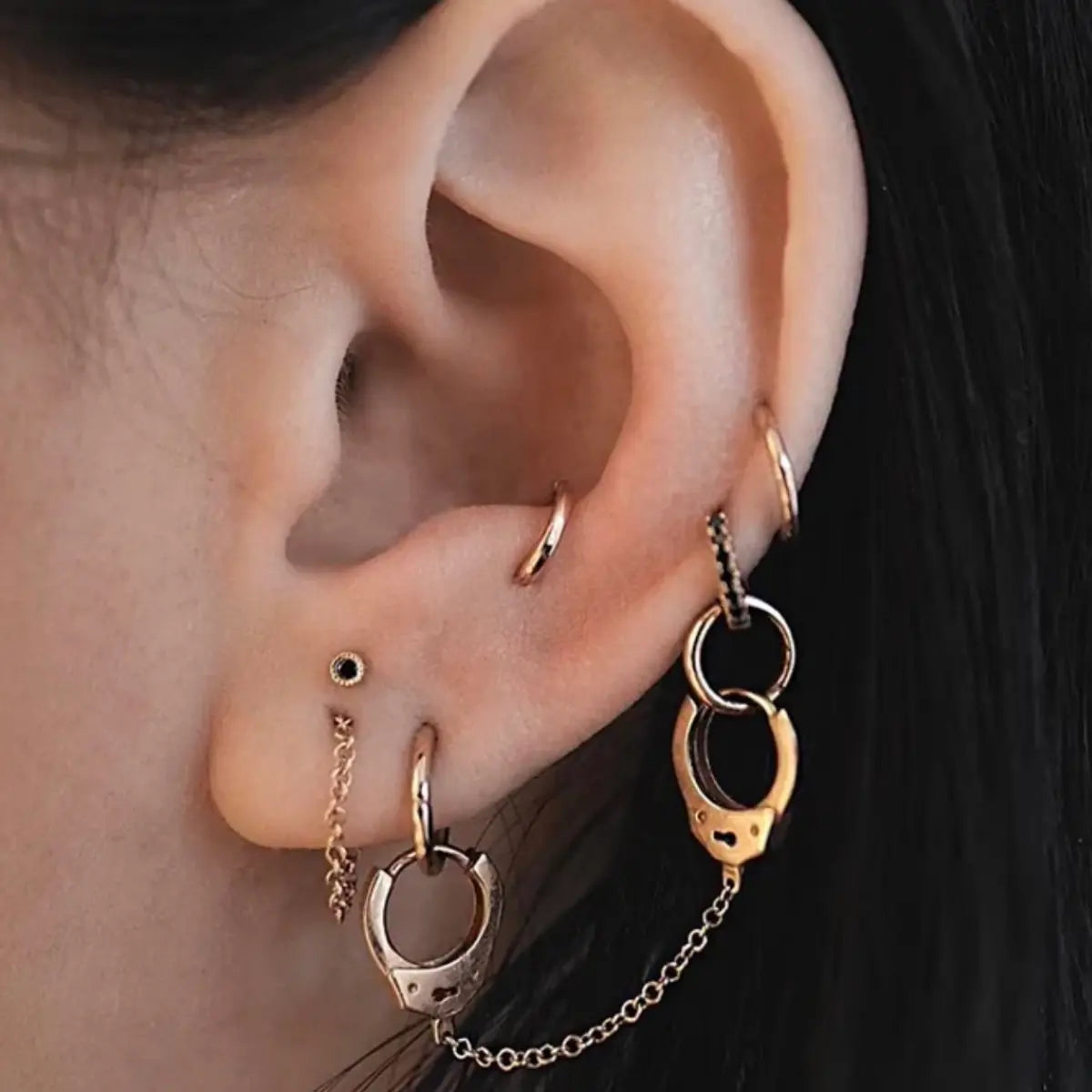 Handcuff Drop Earrings Gold Worn By Female Model Tips