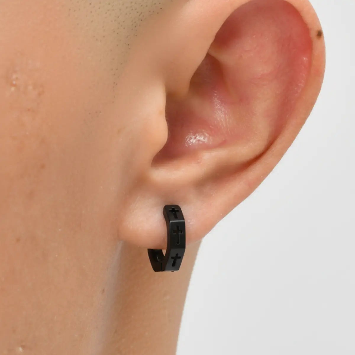 Hexagon Cross Huggie Hoop Earrings Black Worn by Male Model
