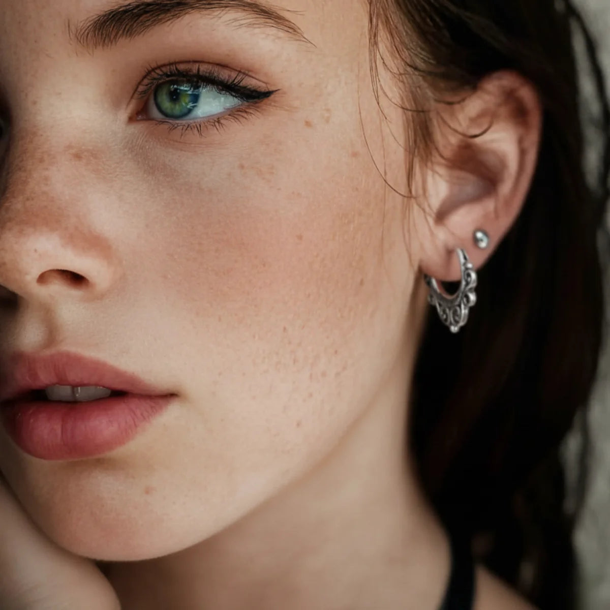 Hollow Scrollwork Hoop Earrings Worn by Female Model