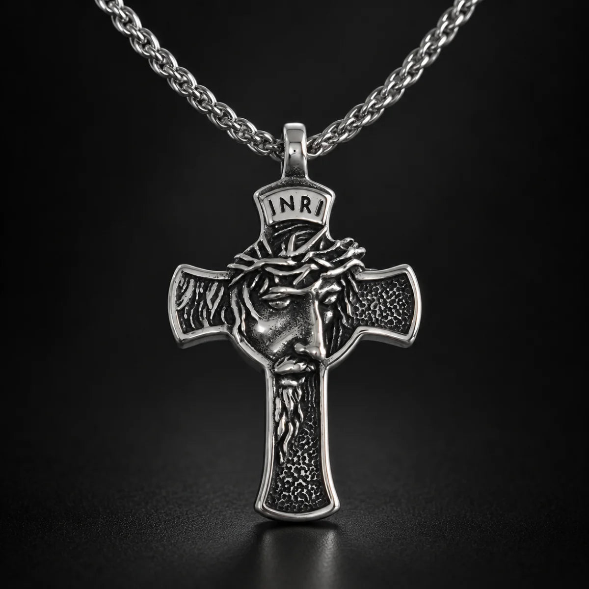 INRI Face of Jesus Cross Pendant Antique Silver Close Up Black Background