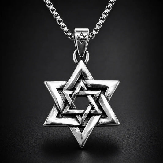 Interlocking Star of David Necklace Silver Close Up Black Background