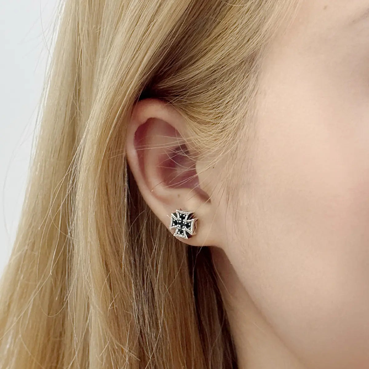 Iron Cross Earrings Sterling Silver Worn by Female Model Close Up