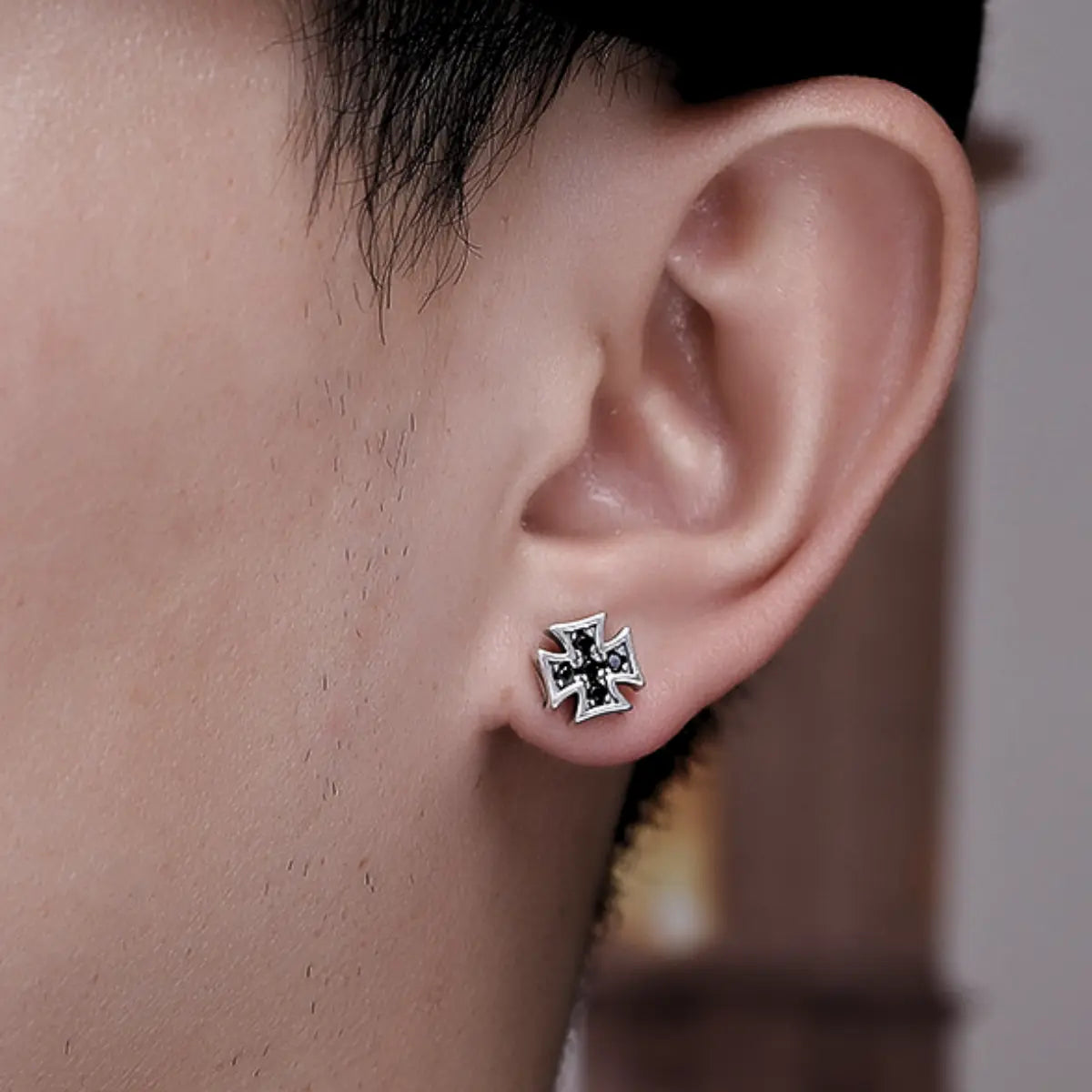 Iron Cross Earrings Sterling Silver Worn by Male Model Close Up