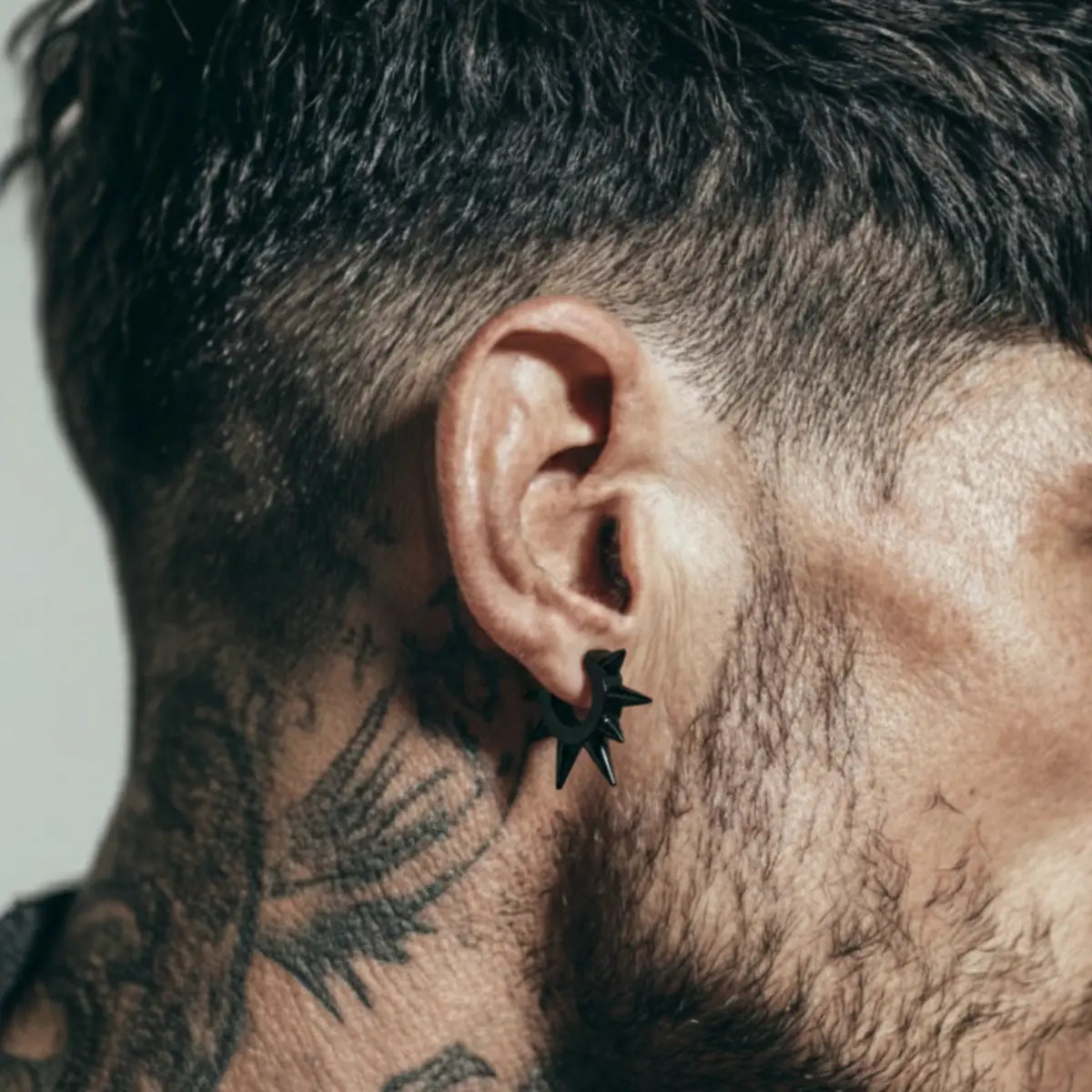 Large Spike Hoop Earrings Black Worn by Male Model