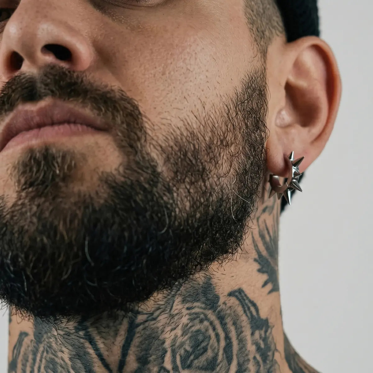 Large Spike Hoop Earrings Silver Worn by Male Model Front
