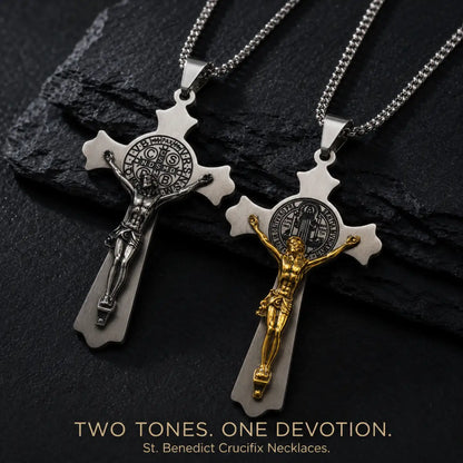 Large St. Benedict Cross Necklaces Silver and Gold Options Displayed on Stone Surface