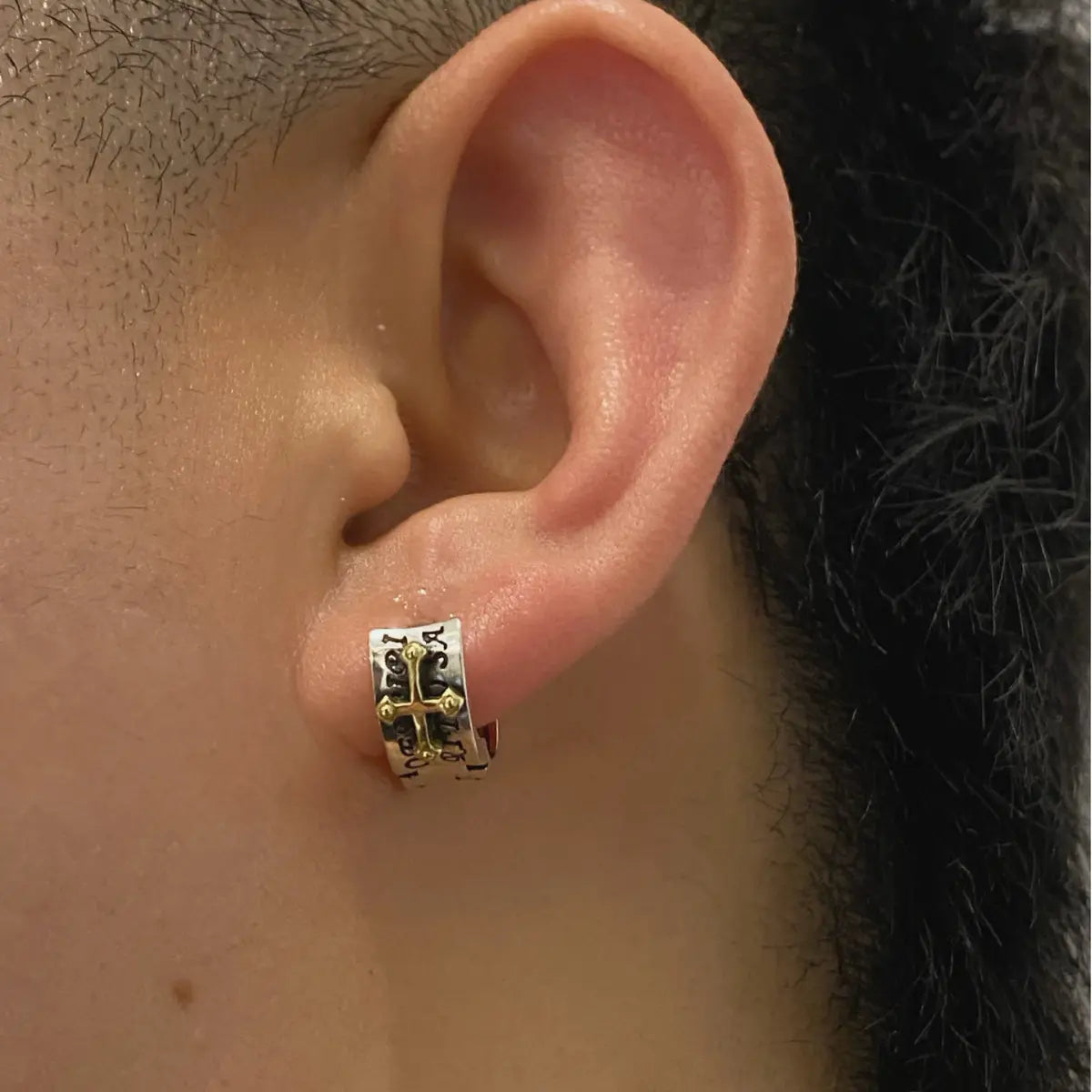 Letter Cross Huggie Hoop Earrings Worn by Male Model Close Up