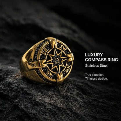 Luxury Compass Ring Gold Displayed on Dark Stone Surface