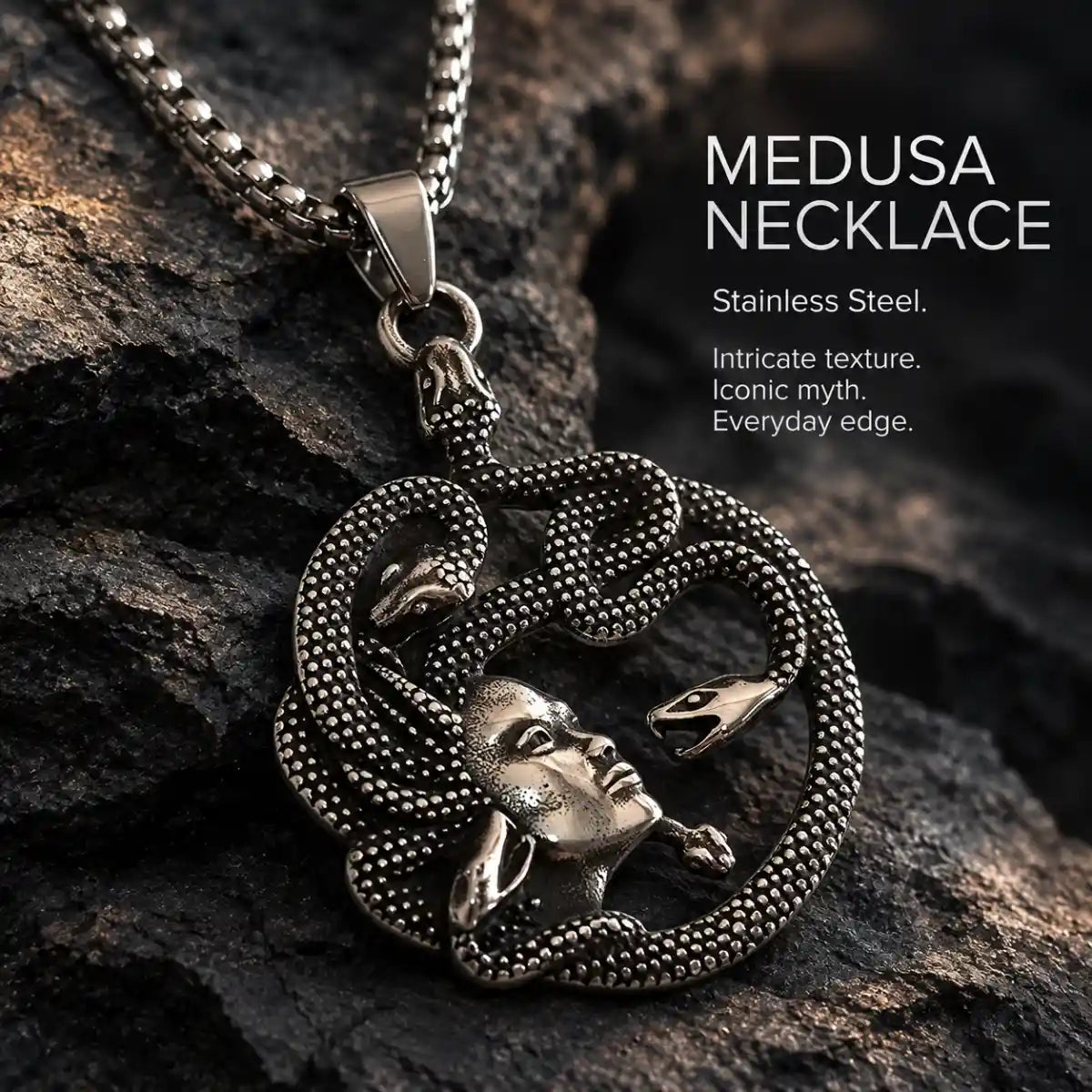 Medusa Snake Necklace Pendant Displayed on Stone Surface