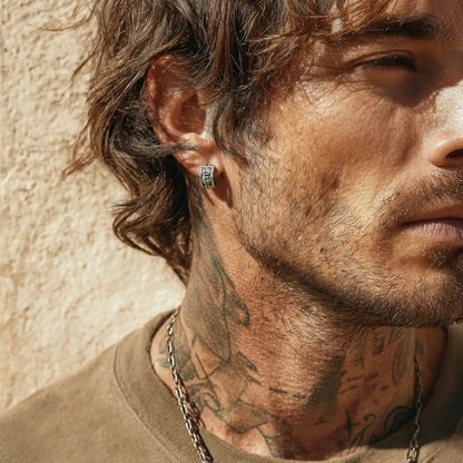 Men's Silver Skull Huggie Hoop Earrings Worn by Male Model