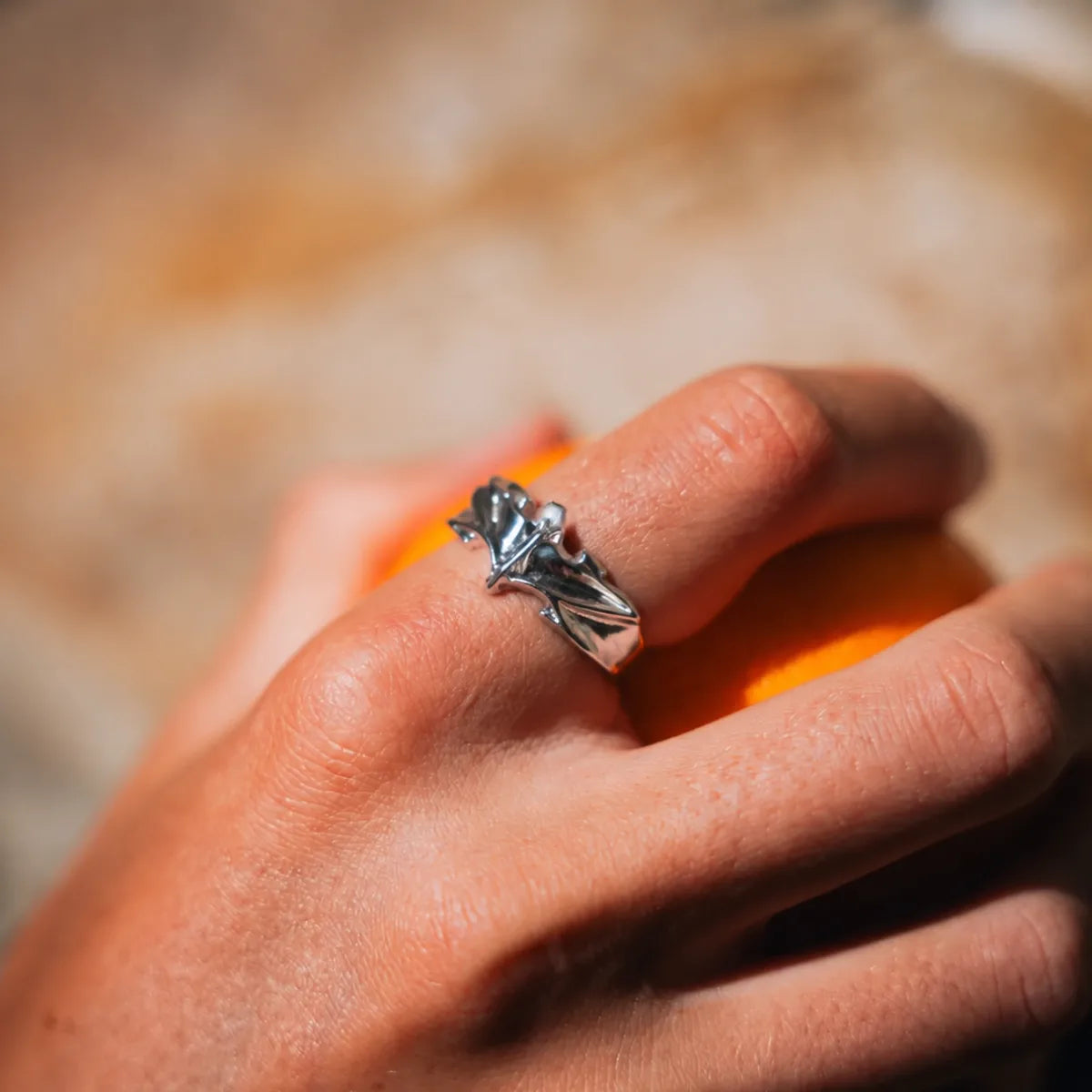Minimalist Bat Ring Silver Worn on Hand Close Up
