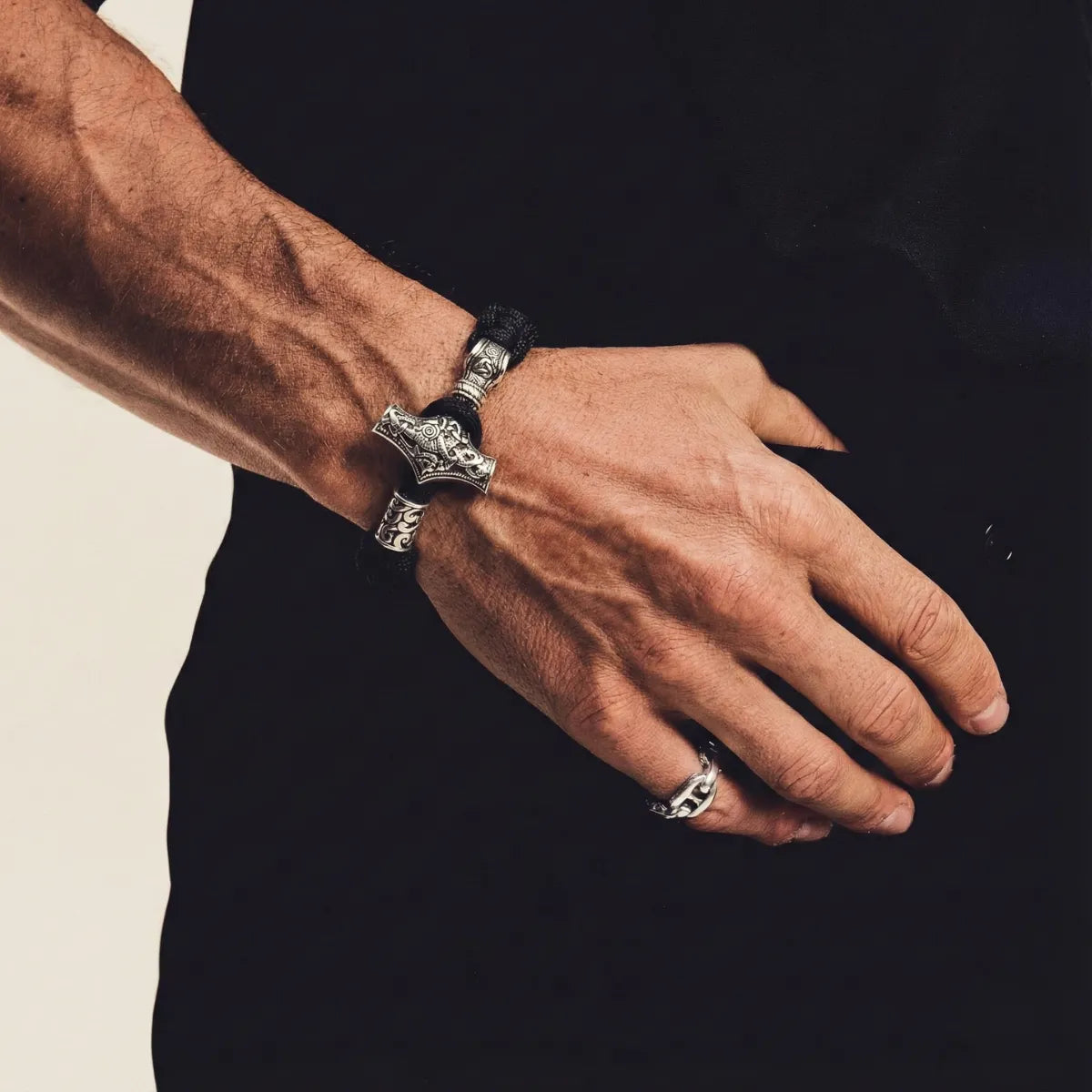 Mjolnir Paracord Bracelet Black & Steel Worn by Male Model