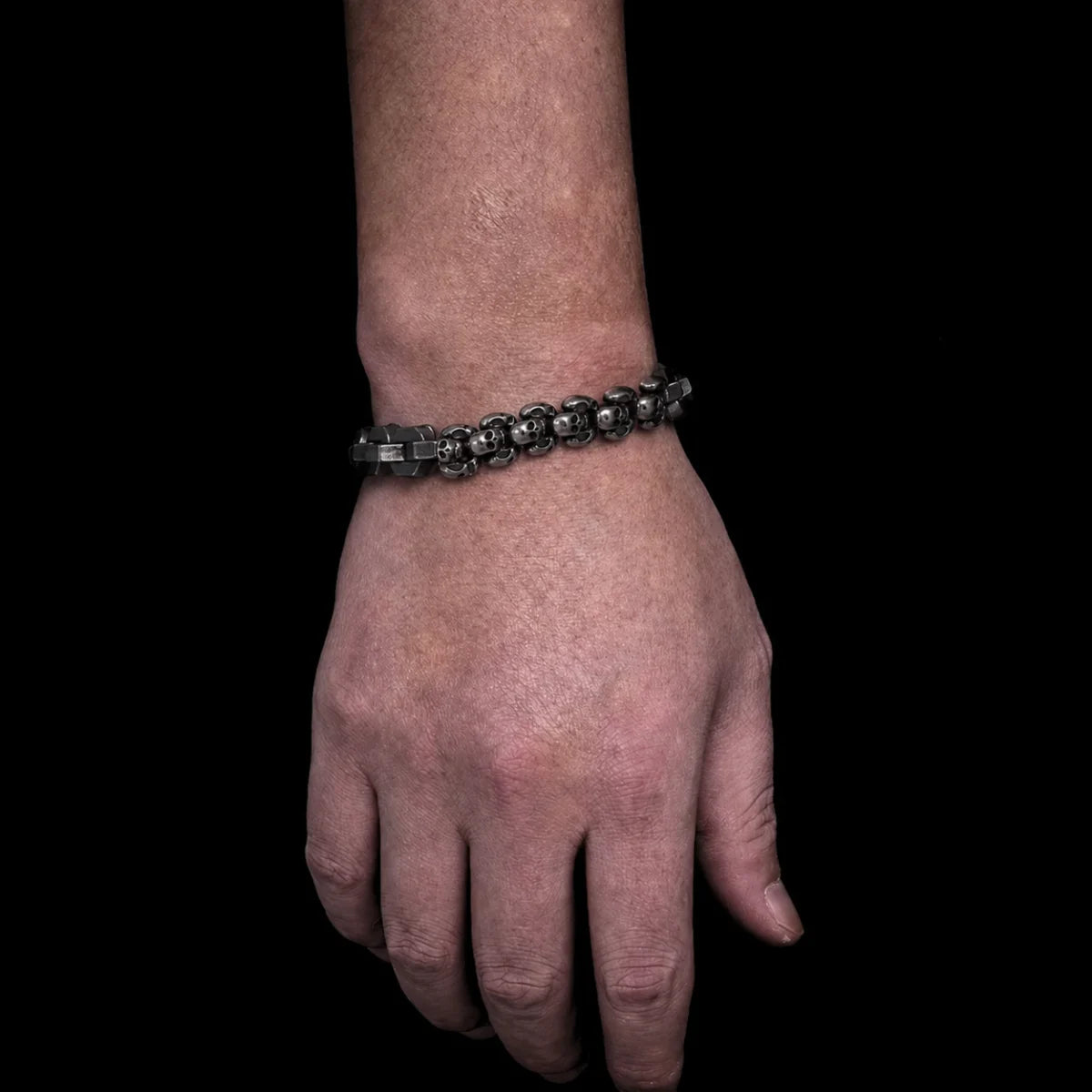 Multi Skull Block Bracelet Antique Black Worn on Hand Close Up