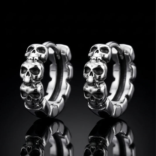 Multi Skull Head Huggie Earrings Silver Pair Close Up Black Background