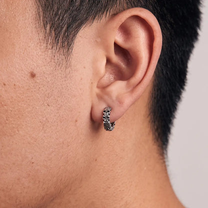Multi Skull Head Huggie Earrings Silver Worn by Male Model Close Up