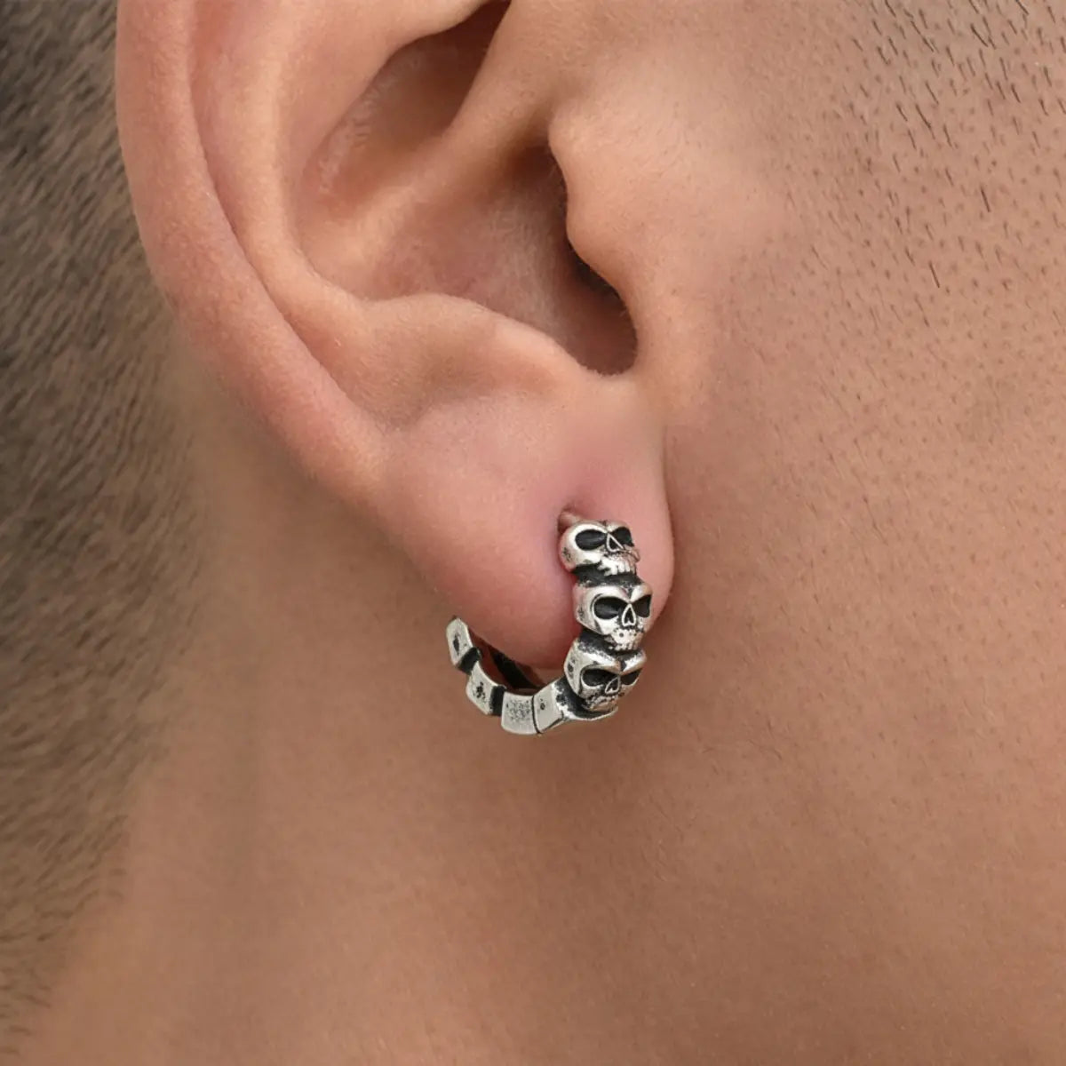 Multi Skull Huggie Hoop Earrings Worn by Male Model