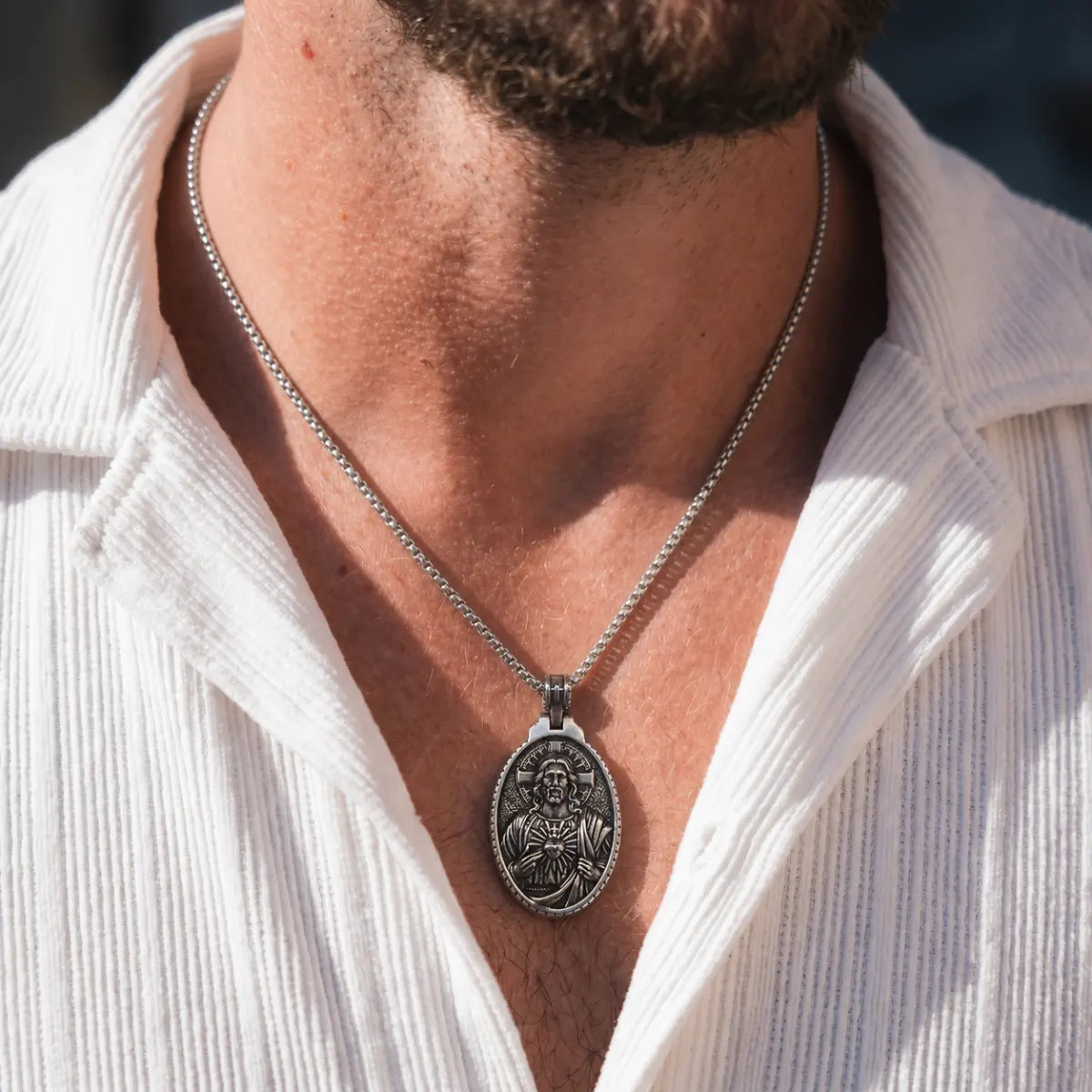 Oval Jesus Cross Pendant with Sacred Heart Silver Worn by Male Model