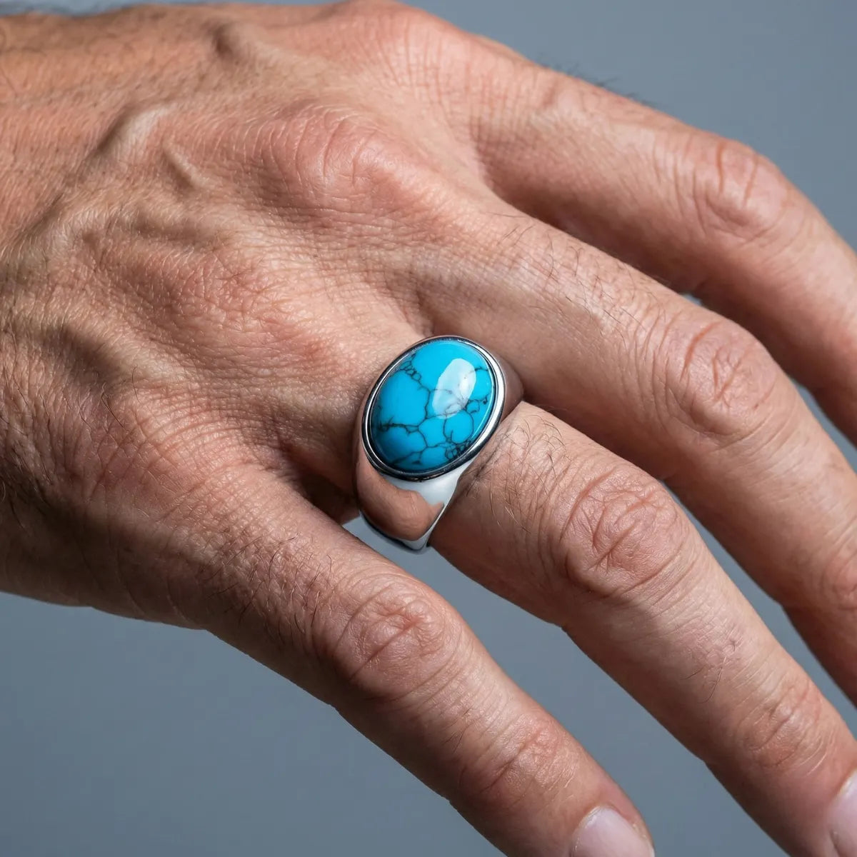 Oval Silver Turquoise Ring Worn by Male Model Close Up