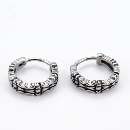 Oxidized Carved Hoop Earrings Silver Lying Down White Background