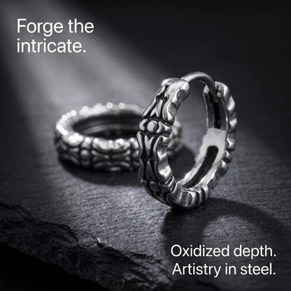 Oxidized Carved Hoop Earrings Silver on Black Stone Surface