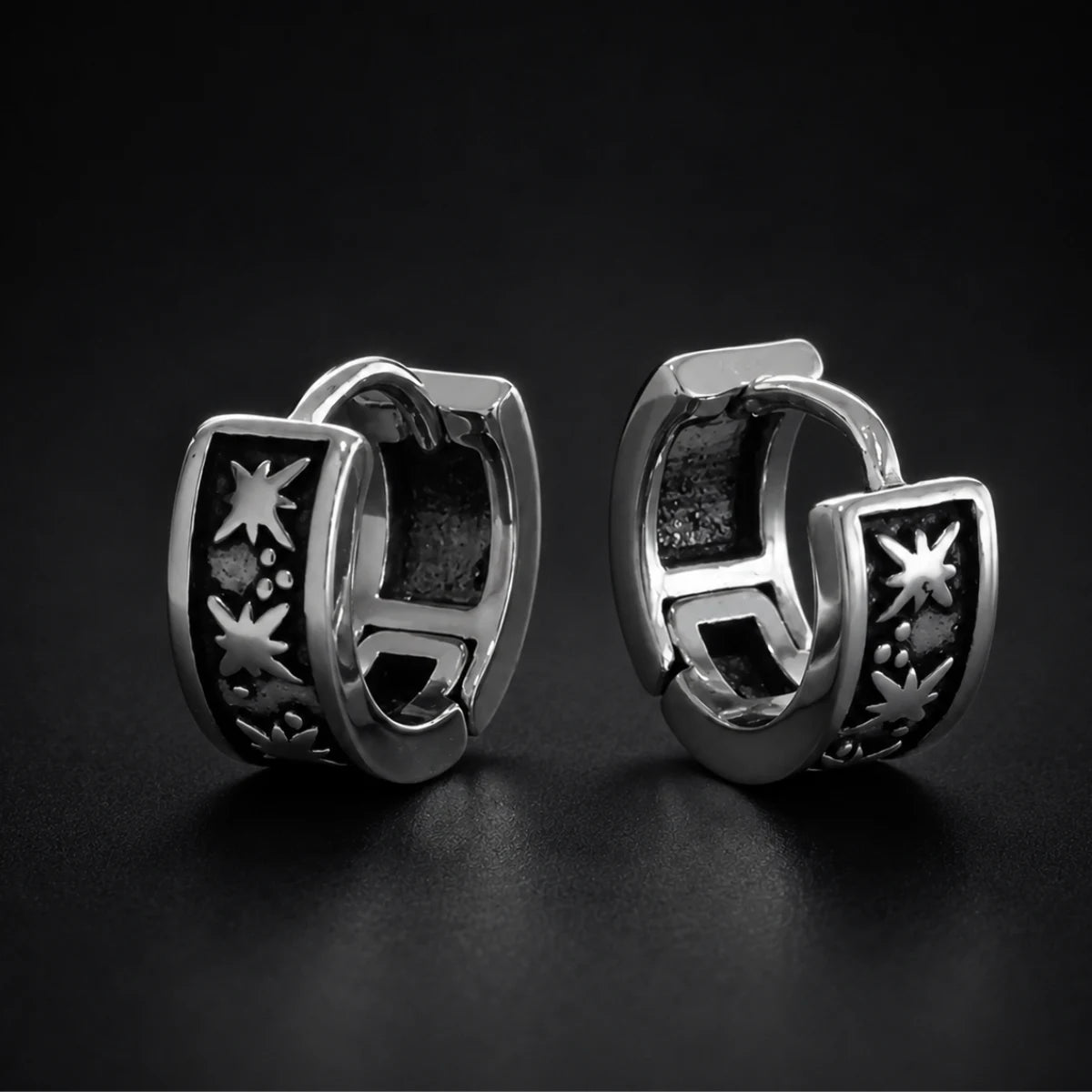 Oxidized Star Hoop Earrings Silver Pair Close Up Black Background