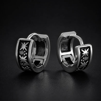 Oxidized Star Hoop Earrings Silver Pair Close Up Black Background