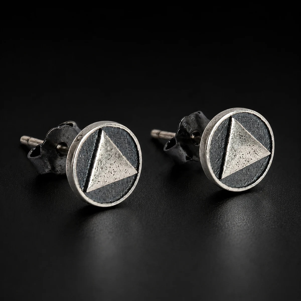 Oxidized Triangle Stud Earrings Silver Pair Close Up Black Background