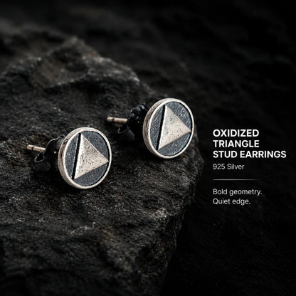 Oxidized Triangle Stud Earrings Silver Pair Displayed on Stone Surface