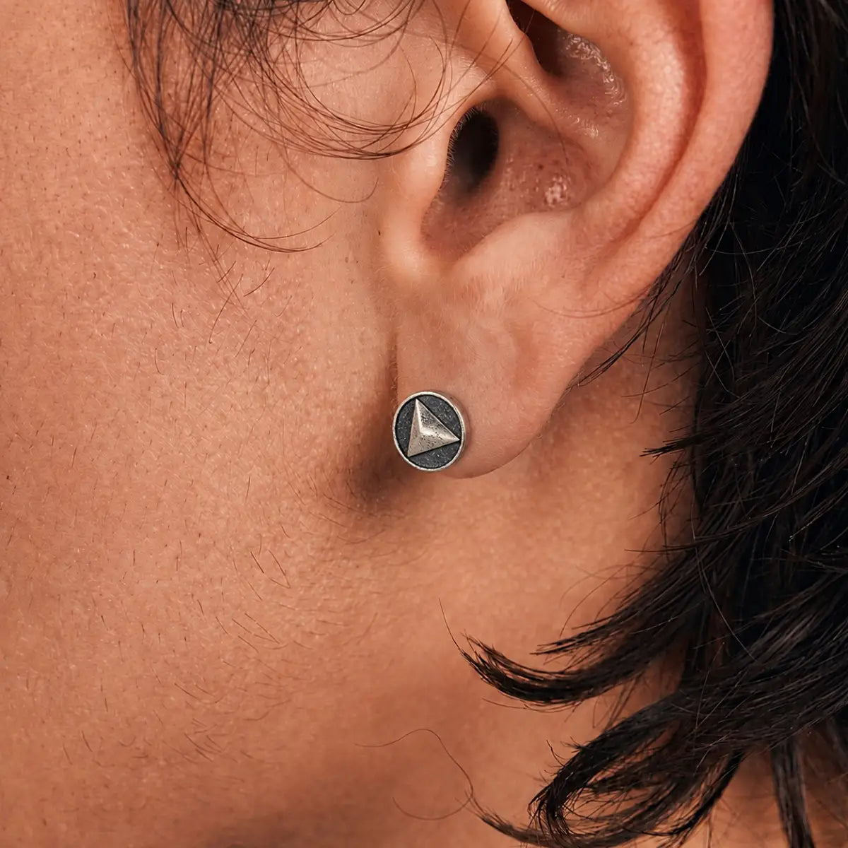 Oxidized Triangle Stud Earrings Silver Worn by Male Model Close Up