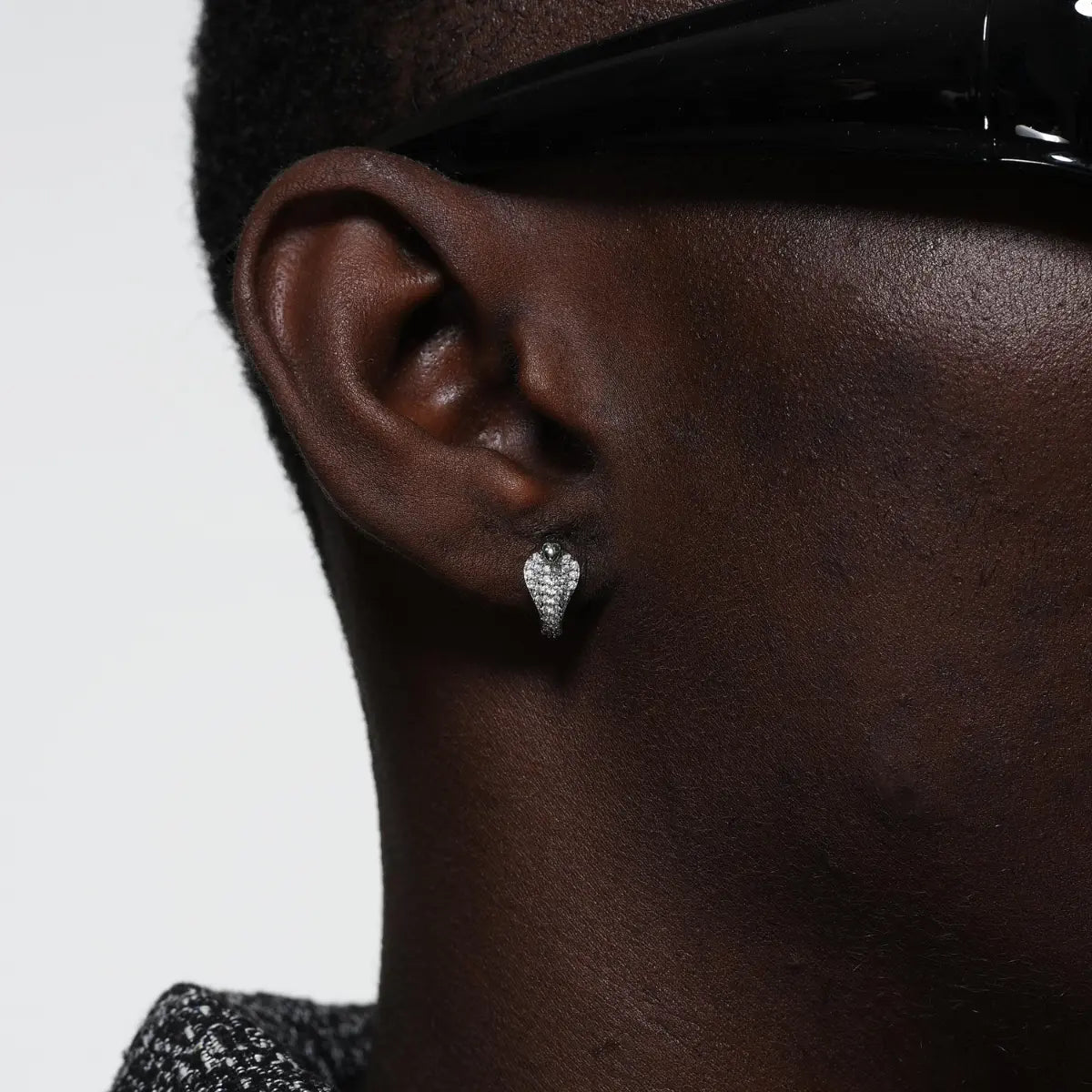 Pave diamond cobra earrings silver worn by male model