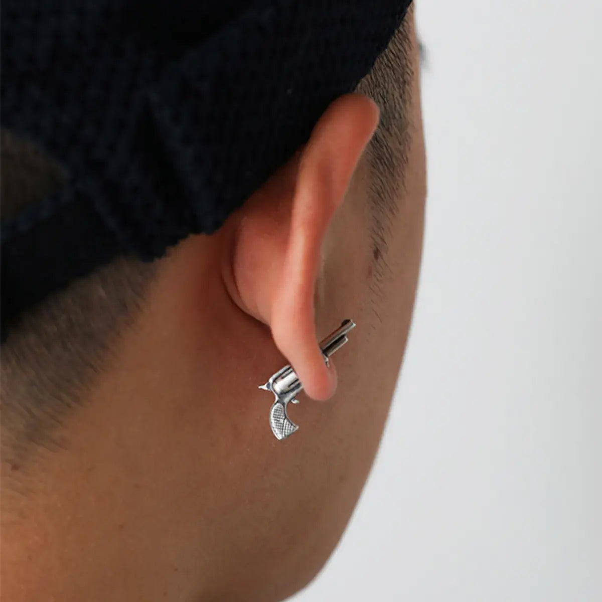 Pistol Stud Earrings Silver Worn By Male Model