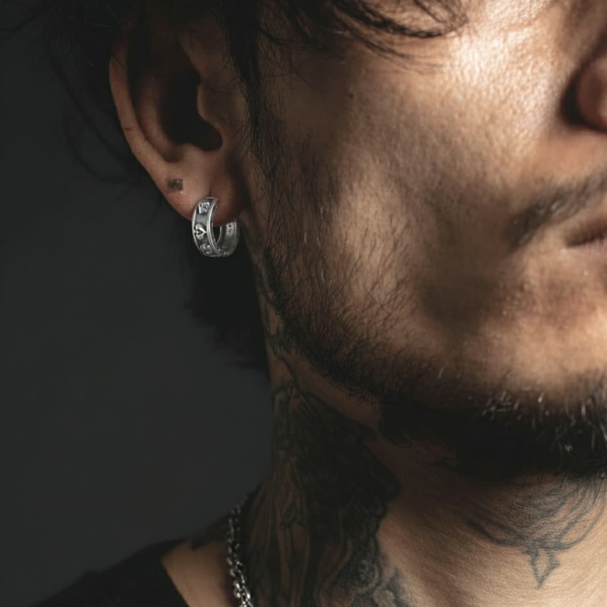 Poker Card Ace of Spades Skull Hoop Earrings Worn by Male Model Front